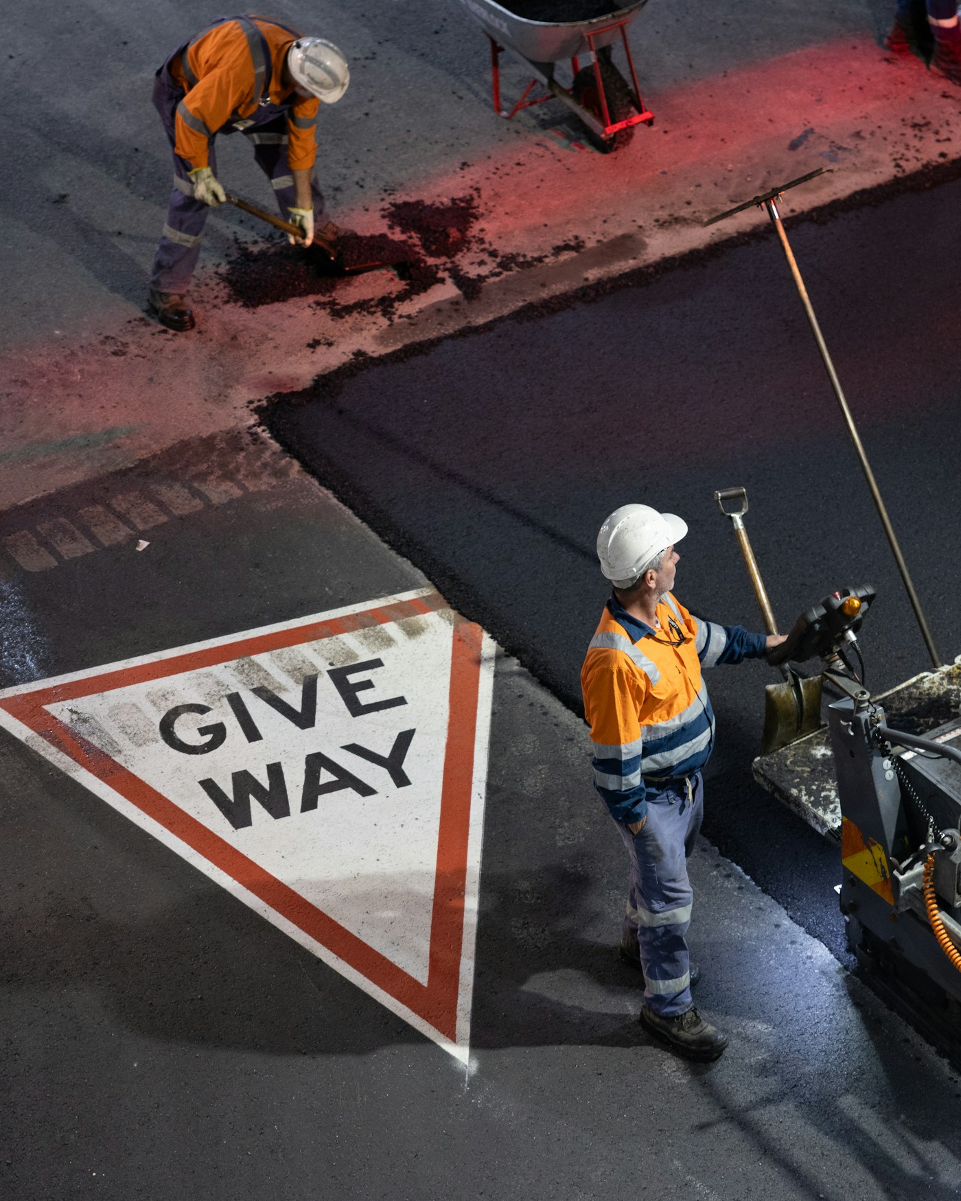 Construction crew at work on an active building site in hi-vis and hard hats